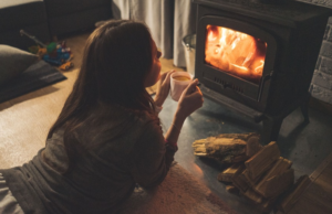 Person Sitting In Front of a Furnace