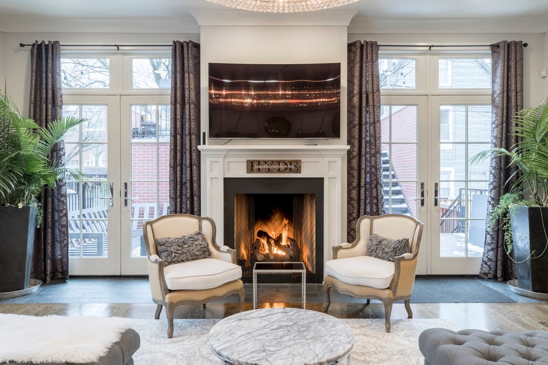 Comfortable living room with chairs, perfect for relaxation in a home with a well-installed furnace.