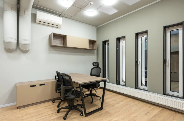 A workspace with a wall-mounted air conditioner