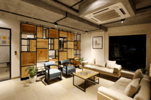 Ceiling-mounted AC unit in a modern lounge area